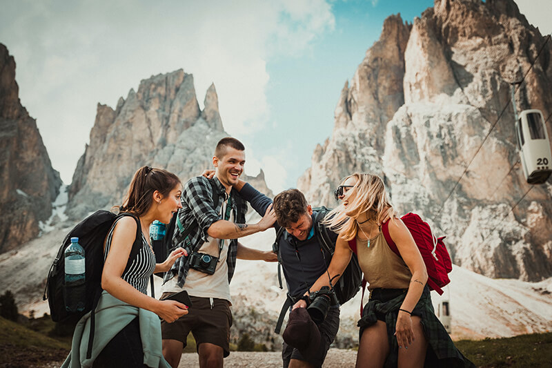 Motivated friends hike up a mountain