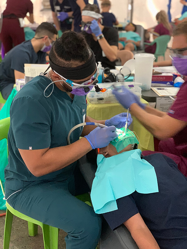 Levi Powell performing dentistry