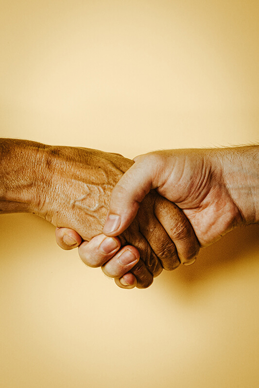 Two people doing a handshake