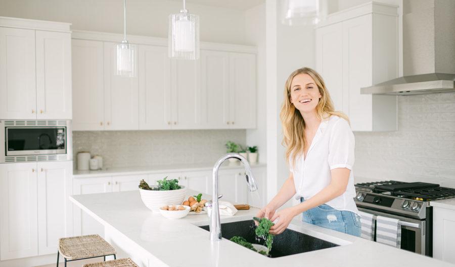 Brittany Ford practicing healthy habits and making a smoothie