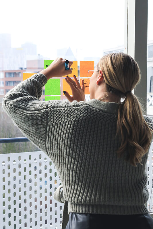 Female college student making research notes