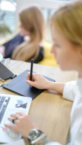 student using technology for design