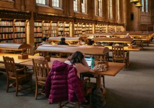 student working on a research paper