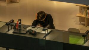 a lone student reading in a library