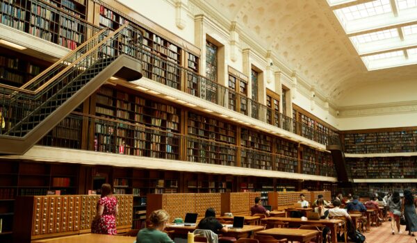 students in a library applying research strategies