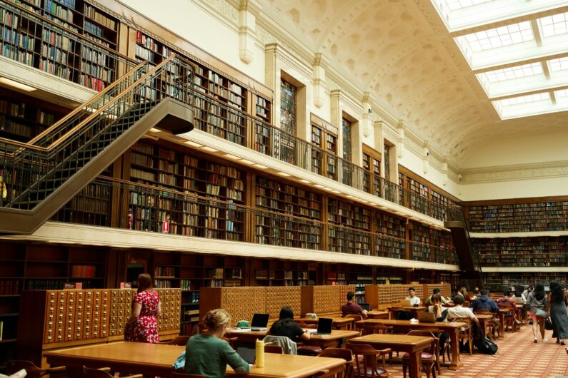 students in a library applying research strategies