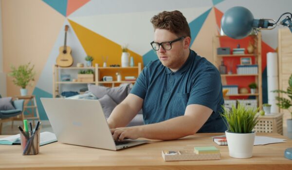 man researching on Expository Essay Topics