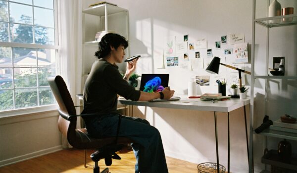 student working on thesis statement examples