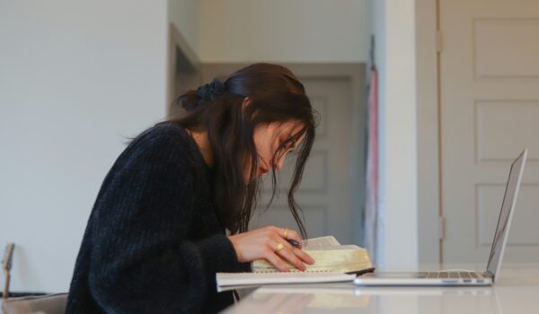 student working on persuasive essay topics